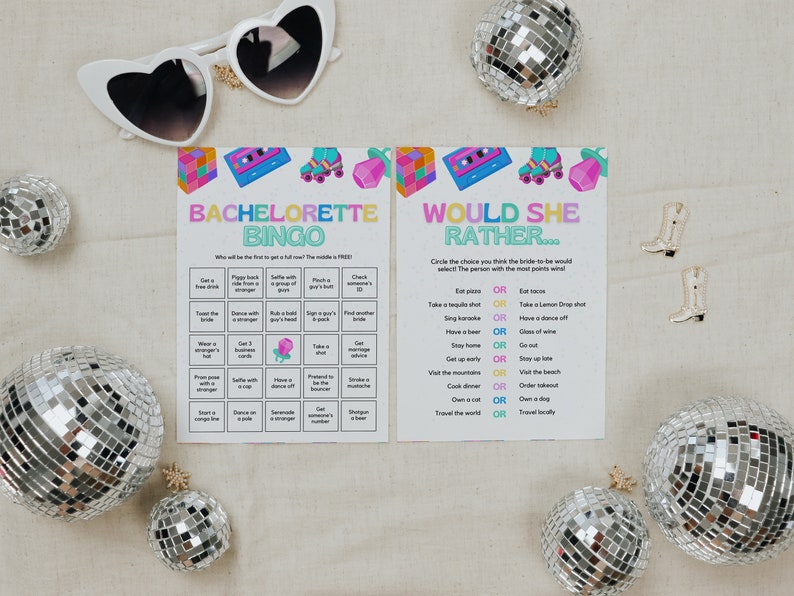 May include: Two printable game cards for a bachelorette party. The first card is a bingo card with tasks like "Get a free drink" and "Dance with a stranger". The second card is a "Would She Rather..." card with questions like "Eat pizza or eat tacos?" and "Sing karaoke or have a dance off?"