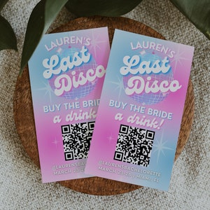 May include: Two pink and blue cards with a disco ball graphic and the text "Lauren's Last Disco" and "Buy the bride a drink!" with a QR code on each card. The text at the bottom of the cards reads "@Laurensbachelorette March 23-26 | Miami, FL".