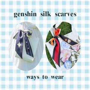 May include: Two ways to wear a silk scarf with a floral print. The first image shows a white tote bag with a black and white scarf tied around the handle. The second image shows a white tote bag with a red, orange, and black scarf tied around the handle.