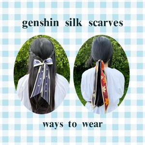 May include: Two women with long dark hair are wearing silk scarves in different ways. One woman has a navy blue and cream scarf tied in a bow in her hair. The other woman has a red and cream scarf tied in a loose knot at the back of her neck. The text "genshin silk scarves" and "ways to wear" is visible in the image.
