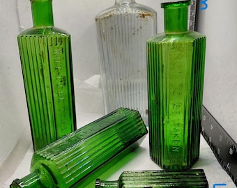 Mixed group of Edwardian Green glass poison bottles