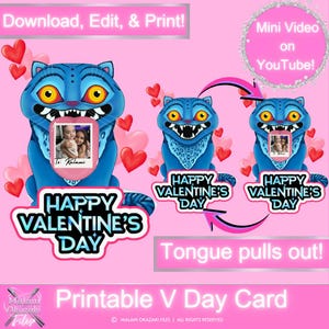 以下が含まれることがあります： 青い漫画の猫が口の中に写真を持っているデジタルバレンタインデーカード。「Happy Valentine's Day」と書かれており、「Download, Edit, & Print!」と「Tongue pulls out!」のテキストが含まれています。