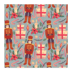 May include: A repeating pattern on a light blue background featuring red nutcrackers, stacked beige gift boxes with red ribbons, red poinsettia flowers, lit candles, candy canes, and small ornaments with green holly leaves and pine needles.