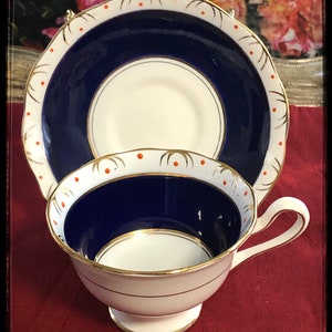 1925-1927 Royal Albert Crown China Teacup & Saucer, Royal Blue on white w/ Tiny Red Dots
