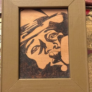 Retro Woodburning Image of Biggie Smalls in a Wooden Frame.