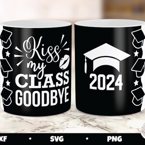 May include: Two black coffee mugs with white text and graduation cap designs. One mug says "Kiss my class goodbye" and the other says "2024".