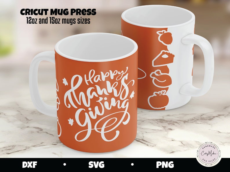 May include: Two orange mugs with white handles. One mug has the text "Happy Thanks Giving" in white lettering. The other mug has a white design of a turkey, a pie, and a pumpkin.