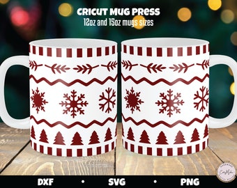May include: Two white ceramic mugs with a festive red pattern featuring snowflakes, trees, and geometric shapes. The mugs have a capacity of 12oz and 15oz. The text "CRICUT MUG PRESS" is at the top.