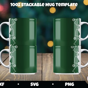 May include: Two 10oz stackable mugs with a green background and a white design of Christmas trees and snowflakes. The mugs are on a wooden surface.  DXF, SVG, PNG.