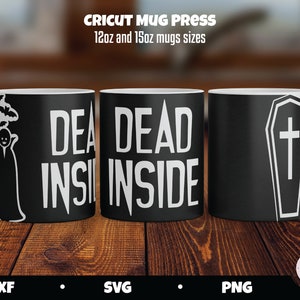 May include: Three black mugs with white text and designs. The mugs are 12oz and 15oz sizes. The text on the mugs reads "Dead Inside". One mug has a vampire design, another has the text "Dead Inside", and the third has a coffin design.