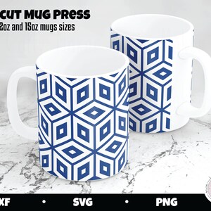 May include: Two white ceramic mugs with a geometric blue and white pattern. The mugs are cylindrical with a handle and are labeled as 12oz and 15oz sizes. The text "CRICUT MUG PRESS" is at the top.