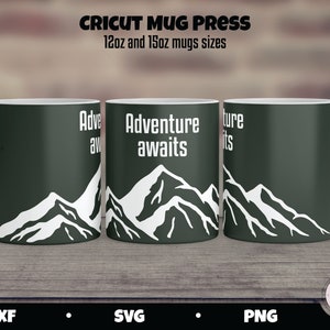 May include: Three 12oz and 15oz green mugs with white mountain silhouettes and the text "Adventure awaits" on the center mug. The mugs are on a wooden surface.