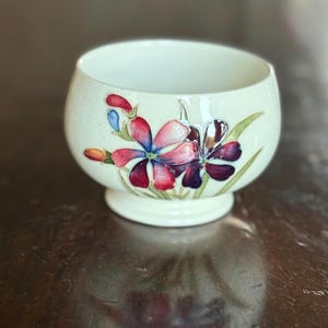 Beautiful Moorcroft Lilly or Iris Diminutive Bowl Vibrant Pinks & Pinks on a White Background