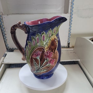 Antique Majolica Art Nouveau Style Pitcher Featuring Cobalt Blues, Red Flowers, and Vivid Green Leaves