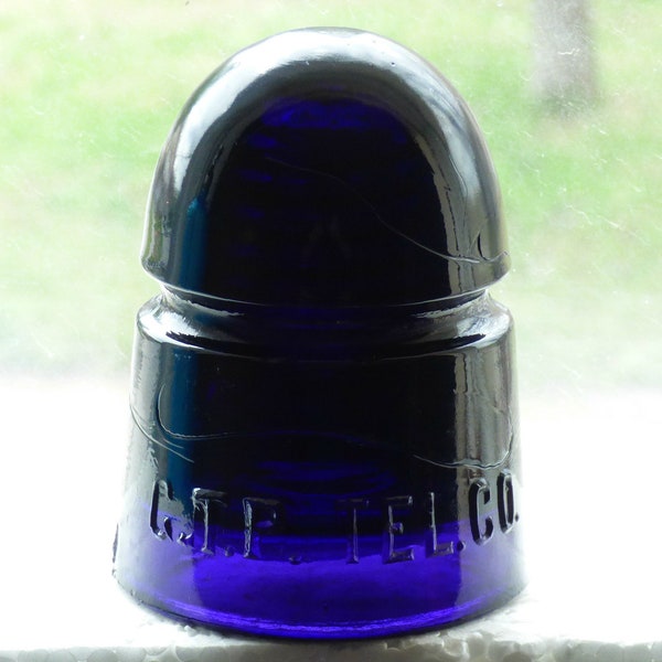 Antique Canadian made purple G.T.P. TEL. CO. glass insulator