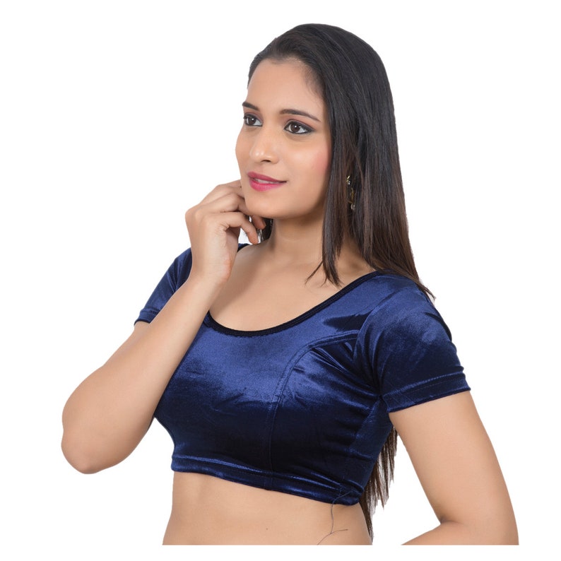 May include: A navy blue velvet blouse with short sleeves and a scoop neckline.