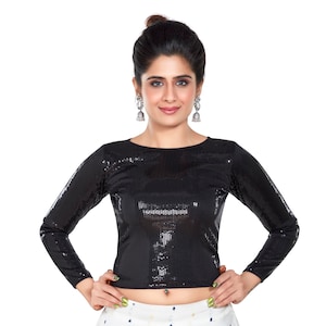 May include: A black long-sleeved sequined top with a round neckline. The top is fitted and cropped.