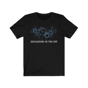 May include: Black t-shirt with a graphic of blue fireworks and the text "EXPLOSIONS IN THE SKY".