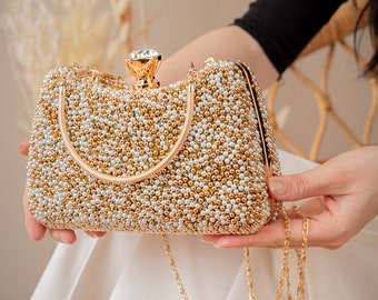 Elegante pochette da sposa e da sera con dettagli dorati in rilievo a mano e pietre preziose scintillanti