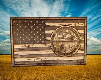 American Flag with a Veteran emblem: We stand for the flag, We kneel for the fallen.