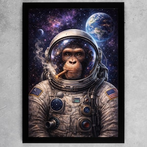 May include: A framed art print shows a chimpanzee in a spacesuit, smoking a cigar. The background features a vibrant galaxy with planets. The spacesuit has an American flag patch. The artwork is set against a grey background.