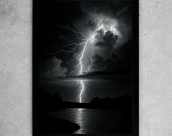 May include: Monochrome framed print depicting a lightning storm over a lake. A bright lightning bolt illuminates the dark clouds and water, with a silhouetted treeline along the horizon.
