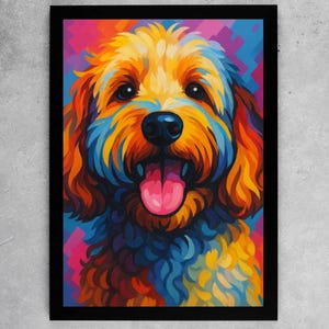 May include: A colourful portrait of a dog in a black frame. The artwork depicts a smiling dog with a pink tongue, and fur in shades of orange, yellow, blue, and pink. The dog's eyes are dark, and the background has geometric shapes.