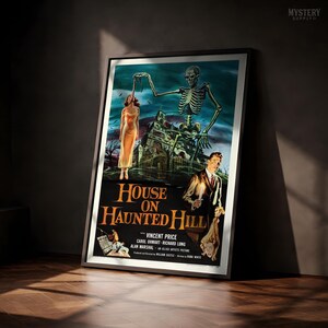 May include: A framed movie poster for House on Haunted Hill featuring a skeleton looming over a house, a person in a yellow dress, and a man holding a candle. The text reads House on Haunted Hill, Vincent Price, Carol Ohmart, Richard Long, Alan Marshal.
