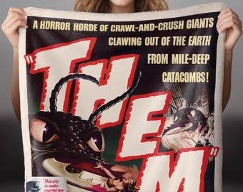 May include: A vintage movie poster for the film "Them!" featuring a giant, red-eyed, black ant crawling over a city. The poster has the text "A horror horde of crawl-and-crush giants clawing out of the earth from mile-deep catacombs!"