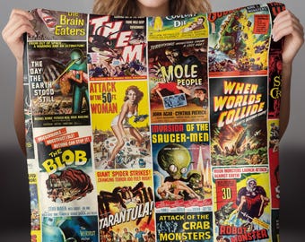 May include: A colorful collage of vintage science fiction movie posters featuring classic monster movie titles like "The Brain Eaters", "Attack of the 50ft Woman", "The Mole People", "When Worlds Collide", "The Blob", "Tarantula", "Invasion of the Saucer-Men", "Attack of the Crab Monsters", and "Robot Monster".