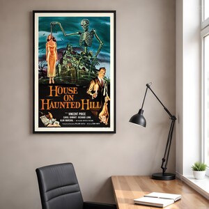 May include: A framed movie poster for House on Haunted Hill featuring a large skeleton looming over a mansion, a person in a yellow dress, and a man holding a candle. The text reads House on Haunted Hill, Vincent Price, Carol Ohmart, Richard Long.