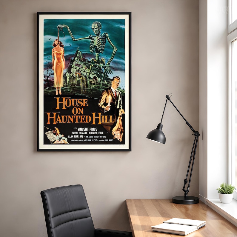 May include: A framed movie poster for House on Haunted Hill featuring a large skeleton looming over a mansion, a person in a yellow dress, and a man holding a candle. The text reads House on Haunted Hill, Vincent Price, Carol Ohmart, Richard Long.