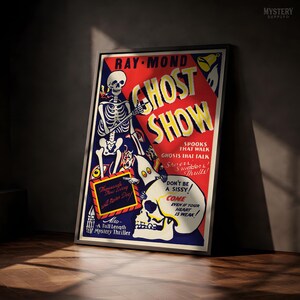 May include: A framed vintage-style poster titled GHOST SHOW featuring a skeleton, a large skull, and text including RAY-MOND, SPOOKS THAT WALK, GHOSTS THAT TALK, DON'T BE A SISSY, COME EVEN IF YOUR HEART IS WEAK, and Thousands Now Living will Never Die.