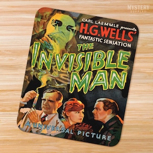 May include: A vintage movie poster for the 1933 film "The Invisible Man" starring Claude Rains. The poster features a green, glowing figure with a black mask and a tagline that reads "Carl Laemmle presents H.G. Wells' Fantastic Sensation The Invisible Man".