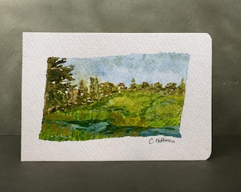 Mini paisaje original en acuarela, 3,5 x 5,5 cm, pradera y arroyo.