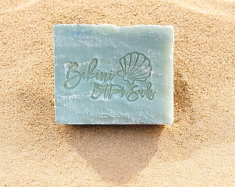 May include: A light blue bar of soap with the text "Bikini Bottom Suds" and a seashell graphic.