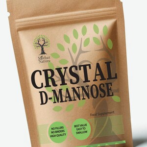 May include: A brown paper bag of Crystal D-Mannose food supplement. The bag features the "Mother Nature" logo, green leaf and tree branch graphics, and the text "No Fillers, No Binders, High Quality" and "Best Value, Easy to Swallow". The words "Made in UK" are also visible.