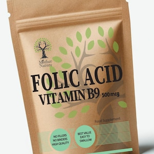 May include: A brown paper bag of Folic Acid Vitamin B9 food supplement. The bag features the words "FOLIC ACID VITAMIN B9 500 mcg" in large black letters. The bag also has the words "Mother Nature" and "Food Supplement" printed on it. The bag is made in the UK.