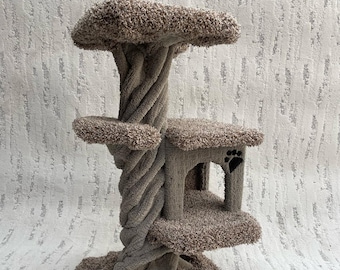 May include: A brown cat tree with a twisted post and multiple platforms covered in brown carpet. The top platform is a large, flat surface. The middle platform has a small, enclosed space with a paw print cutout.