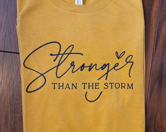 Stronger than the storm, Inspirational apparel, T-shirts, ladies apparel