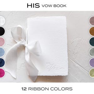 May include: A white vow book with the embossed text "HIS Vow" tied with a white ribbon. The image shows a selection of 12 ribbon colors, including black, pink, and blue. The book is presented on a textured white surface.