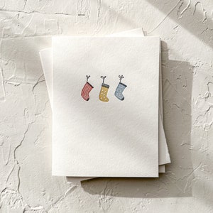 Medias navideñas - Tarjeta navideña con tipografía minimalista