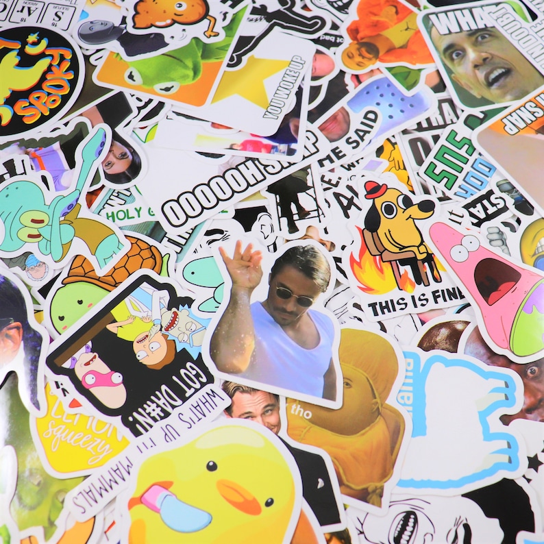 May include: A collection of colorful and humorous stickers featuring popular internet memes and cartoon characters. The stickers include images of Spongebob Squarepants, a dog sitting on a chair, a turtle, and a man with sunglasses making a hand gesture. The text on the stickers includes phrases like "What's up mammals", "Got Damn", "This is finl", "You woke up", and "Holy &".
