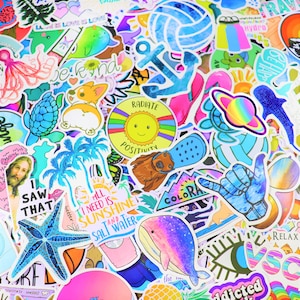 May include: A collection of colorful stickers featuring various designs, including a palm tree, a whale, a sun, a starfish, a dog, a turtle, a volleyball, an anchor, and the text "Radiate Positivity".