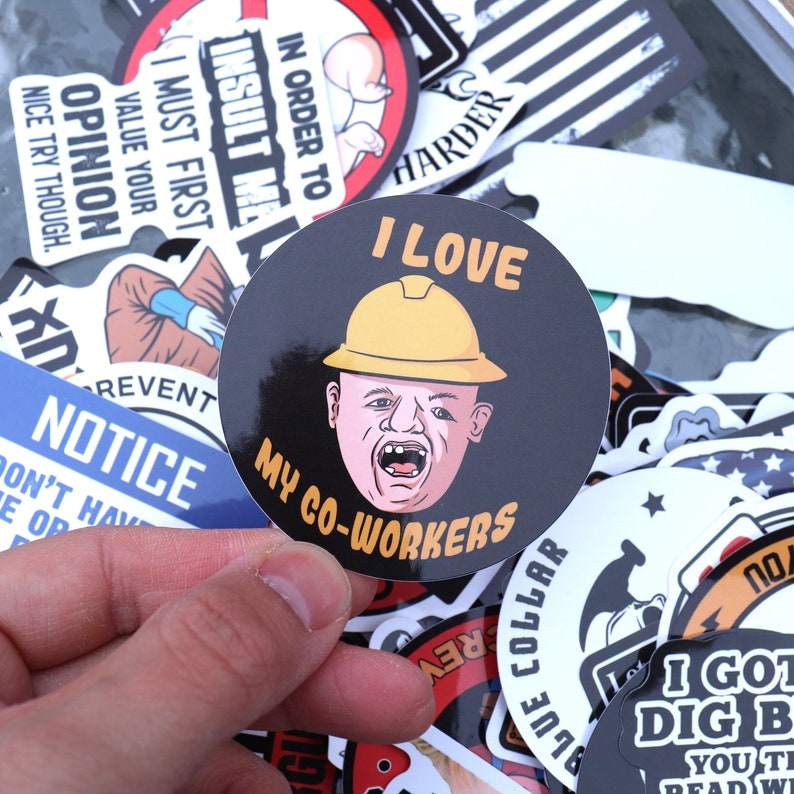 May include: A collection of colorful stickers with various designs and phrases, including "I Love My Co-Workers" and "I Must First Value Your Opinion".