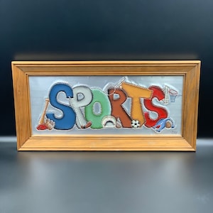 Vintage 1997 framed embossed aluminum “SPORTS” wall art signed by artist. Football, baseball, basketball, tennis, soccer.