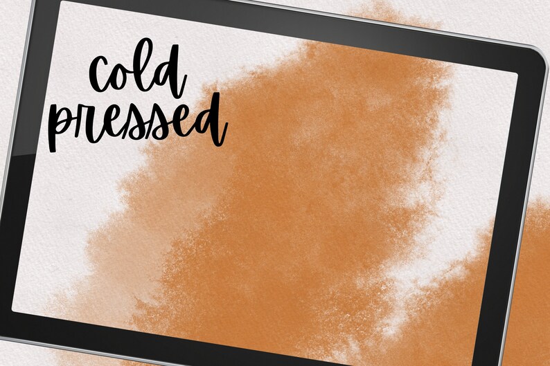May include: A digital tablet screen displaying a brown watercolor background with the text "cold pressed" in black.