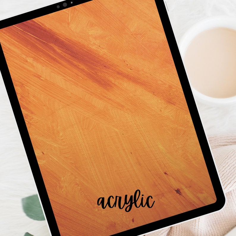 May include: A digital tablet with a textured orange background and the word "acrylic" written in black cursive.