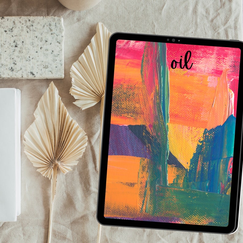 May include: A digital tablet displaying an abstract painting with vibrant colors, including red, orange, yellow, green, and purple. The word "oil" is written in black on the screen.