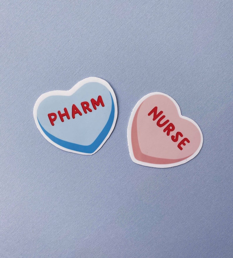 May include: Two heart-shaped stickers, one blue with the word "PHARM" and one pink with the word "NURSE".